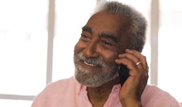 Older man taking a call on his mobile phone